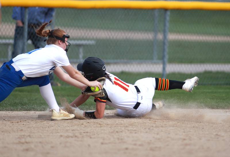 Geneva's Kat Cerwin reaches for Batavia's Mackenzie Krauch as she safely slides into third base during a game on Tuesday, May 6, 2025 in Batavia.