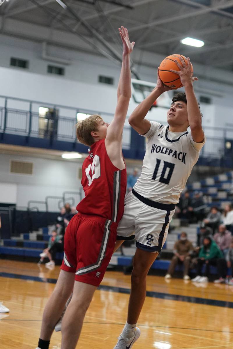 Oswego East's Damien Lewandowski shoots the ball in the post against Hinsdale Central's Tyler Thick during a hoops for healing tournament basketball game at Oswego East High School on Tuesday, Nov. 26, 2024.