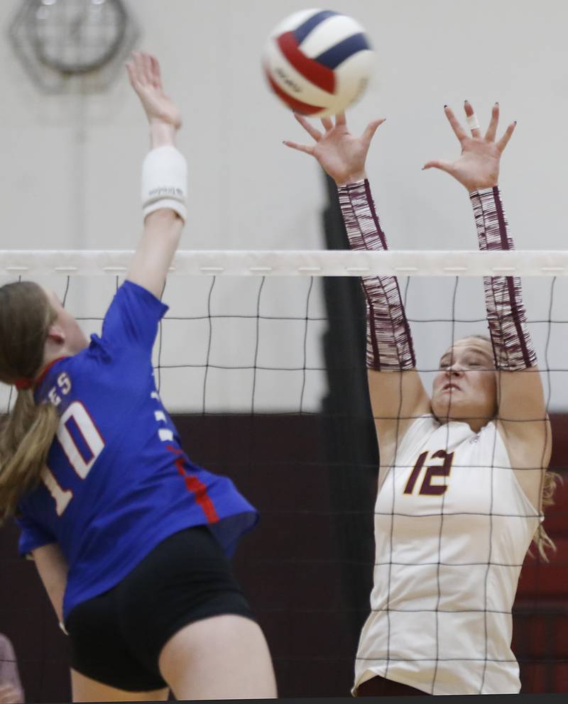 Richmond-Burton's Zoe Freund (right) tries to block the spike of Lakes’ Isabel Stauber during a nonconference volleyball match on Monday, Sept. 29, 2025, at the Richmond-Burton High School in Richmond.