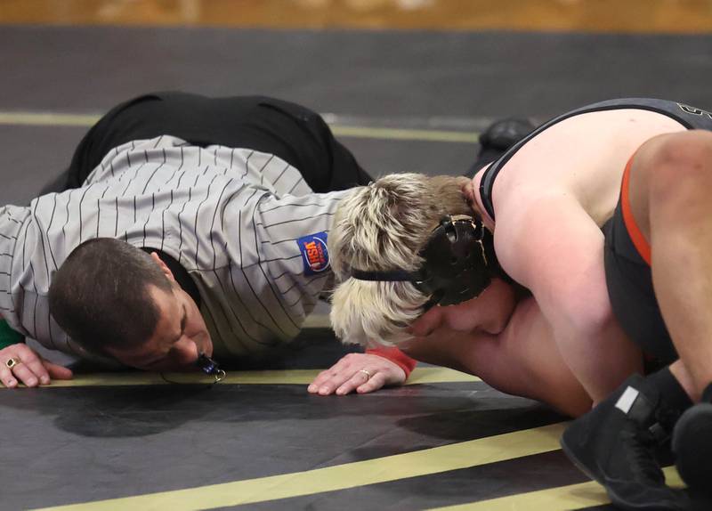 Sycamore’s Adam Carrick pins DeKalb’s 
Mario Cosme at 215 pounds Friday, Jan. 16, 2026, at Sycamore High School.
