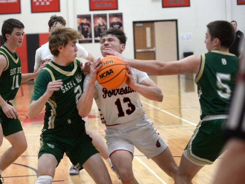 Forreston's Kendall Erdmann (13) draws contact from Peru St. Bede's Kaden Nauman (2) and Haden Huenenburg (5) as he drives to the basket on Wednesday, Feb. 26, 2025 at the 1A Amboy Regional at Amboy High School. Erdmann scored 25 points in the Cardinals' 67-56 win.