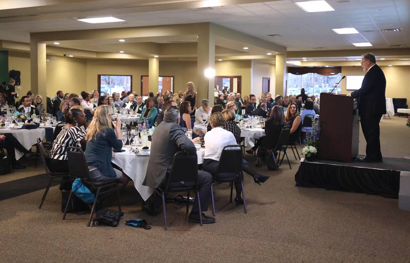 Paul Borek, Executive Director and Enterprise Zone Administrator for the DeKalb County Economic Development Corporation, speaks to a full house Thursday, April 28, 2022, about the development growth in the county over the past year. Borek was speaking during the annual DCEDC dinner and state of the county event at Faranda's Banquet Center in DeKalb.