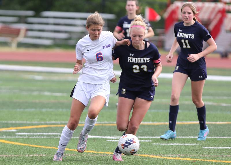 Pleasant Plains' Caroline Willenborg (left) and IC Catholic Prep's Molly Ryan go after the ball during the IHSA Class 1A state girls soccer third place game Saturday, May 27, 2023, at North Central College in Naperville.
