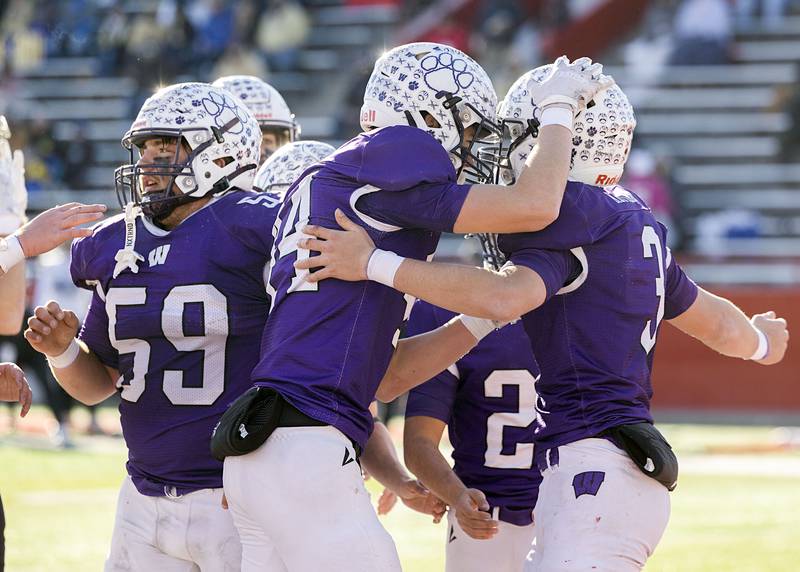 Wilmington's Ryan Kettman (right) is congratulated after scoring a TD against Maroa-Forsyth Friday, Nov. 28, 2025, in the Class 2A football finals at Hancock Stadium at ISU.