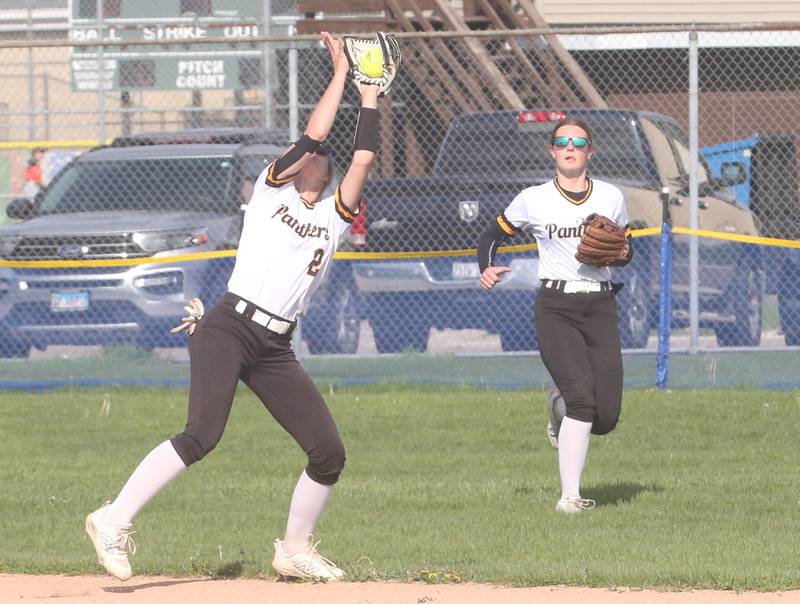 Putnam County's Ella Pyszka makes a catch as teammateKennedy Holocker runs in to assist on Tuesday, April 29, 2025 in Ottawa.