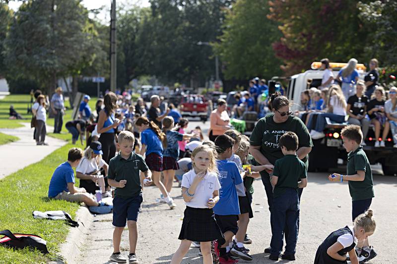 Kids line the streets hoping for candy during the Newman High School homecoming parade Friday, Sept. 29, 2023.