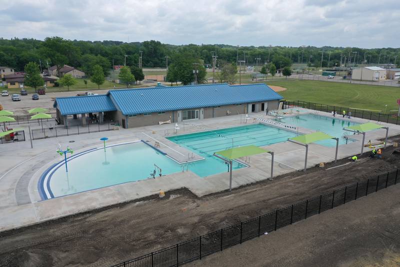 Workers fill Riordan Pool on Tuesday, June 13, 2023 in Ottawa. The pool will open June 19 to the public. The construction of the 6.7 million dollar pool began in September of 2022. The facility includes a 9,700 square foot pool, complete with a zero foot entry, six 70-foot competition lanes and three diving stands, plus a 5,700 square foot building containing private family changing rooms, locker rooms, showers, restrooms and offices.
There will be a shelter with picnic tables, vending machines and tables for umbrellas.