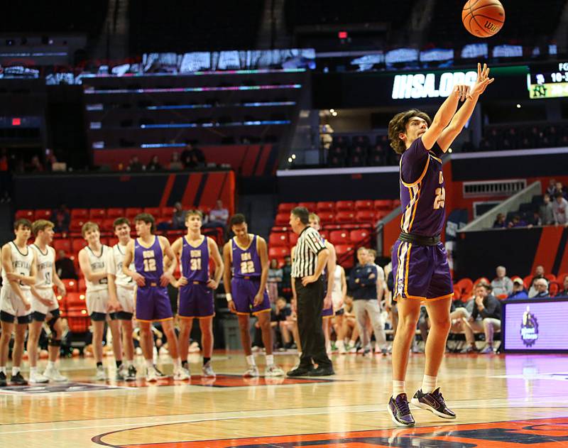 Downers Grove North's Jake Fiegen shoots a free throw after a technical foul was called on New Trier late in the fourth quarter during the Class 4A state third place game on Friday, March 10, 2023 at the State Farm Center in Champaign.