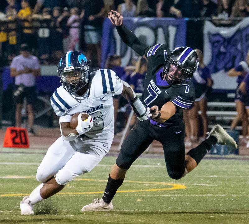 Downers Grove South's Deon Davis (6) carries the ball against Downers Grove North during a football game at Downers Grove North High School on Friday, Sep 9, 2022.