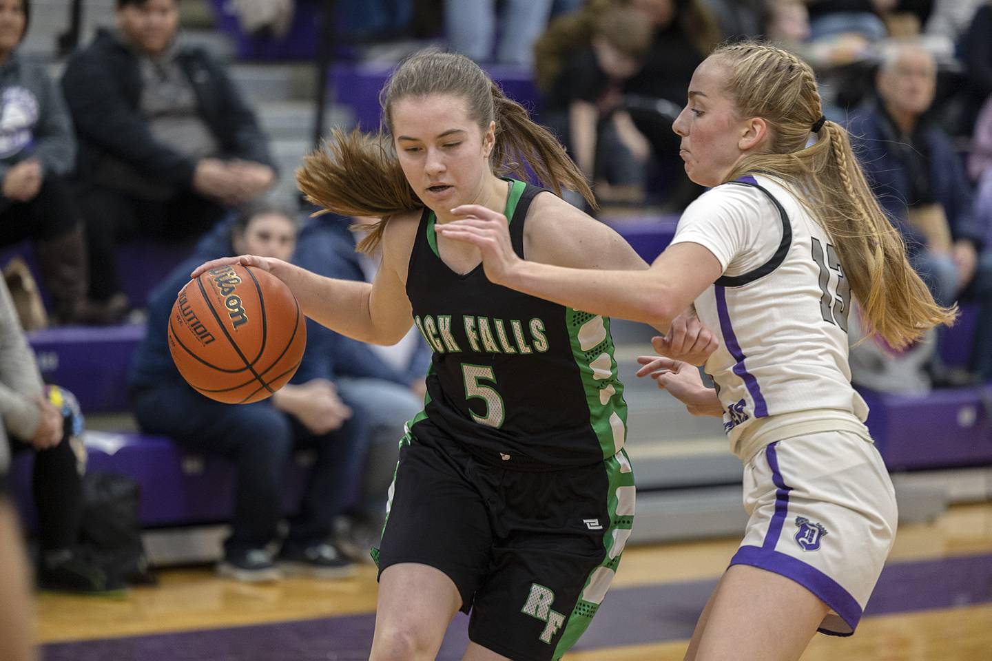 Rock Falls’ Rylee Johnson drives to the hoop against Dixon’s Kait Knipple Wednesday, Feb. 1, 2023.