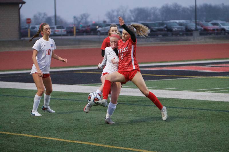 Huntley's Brooke Maxedon battles for the ball with Marian Central's Greta Fortin on Wednesday March 22, 2023 in Huntley.