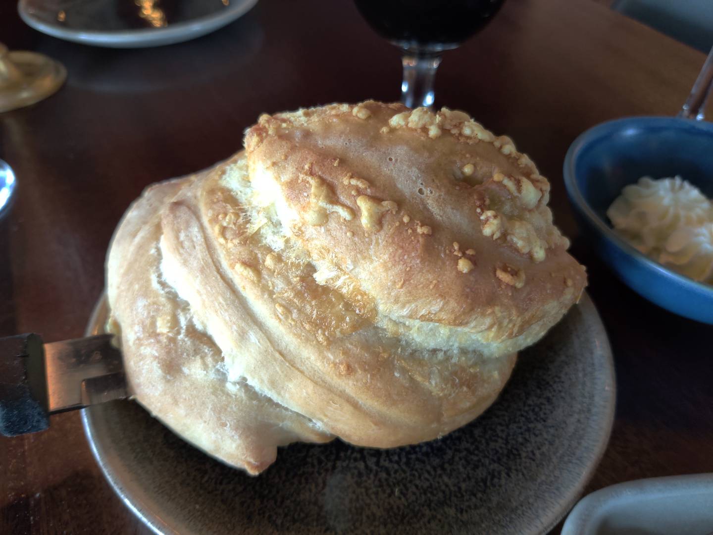 A loaf of in-house-baked bread accented with Gruyere and garlic oil at The Graceful Ordinary in St. Charles.