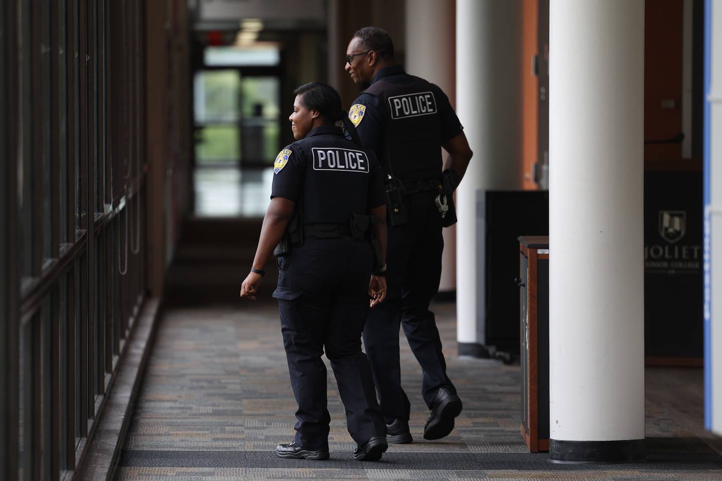 Joliet Junior College Officer Destiny Griffin patrols the campus halls with her field training officer Detective Joe Eckols on Wednesday, July 26 in Joliet.