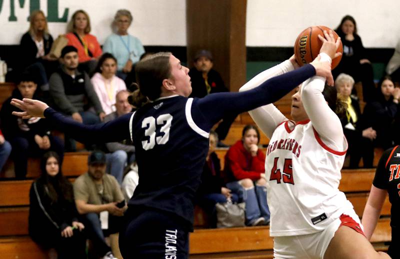 Cary-Grove's Elizabeth Mjaanes fouls Huntley's Madison Diaz as she shoots the basketball during the girl’s game of McHenry County Area All-Star Basketball Extravaganza on Sunday, April 13, 2025, at Alden-Hebron’s Tigard Gymnasium in Hebron.