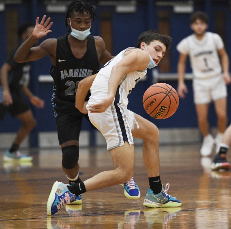 John Starks/jstarks@dailyherald.com
Addison Trail’s Sammy Rent loses control of the ball as Willowbrook’s Noah Campbell guards him in a boys basketball game in Addison on Tuesday, January 18, 2022.