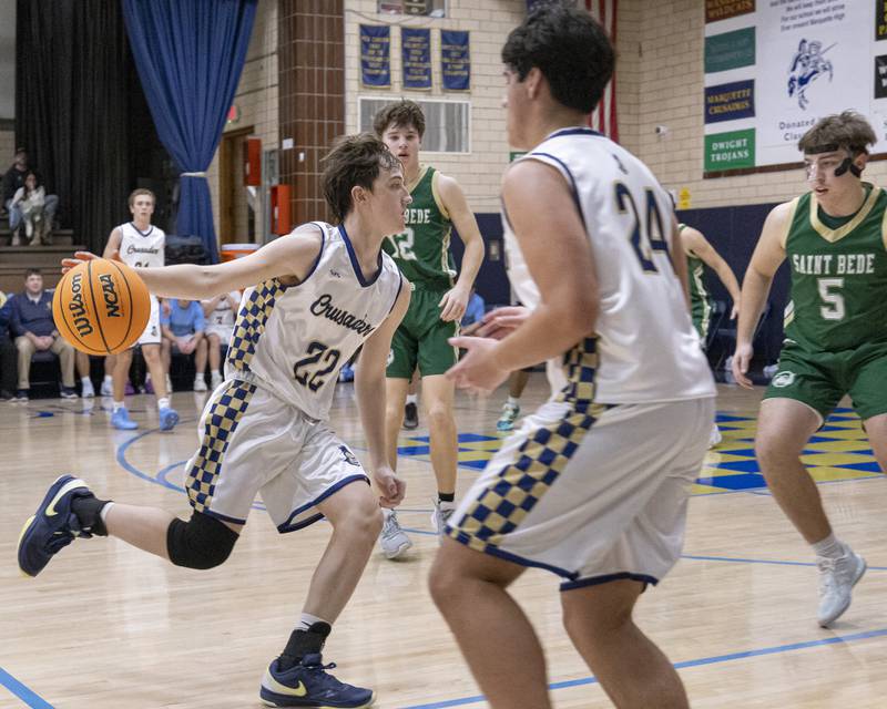 Griffin Dobberstein of Marquette runs the ball down the court against St. Bede during the game on January 10, 2025 at Marquette Academy.