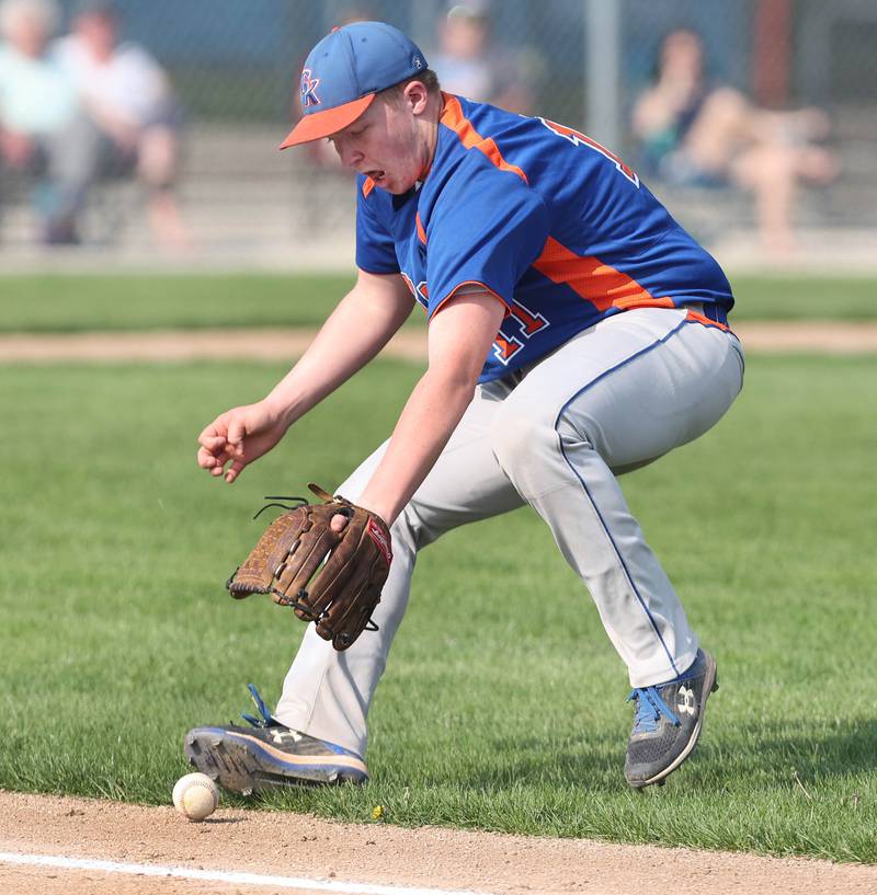 Genoa-Kingston's Ben Younker has to field a ball that barely stays fair during their game against Byron Tuesday, May 10, 2022, at Genoa-Kingston High School.