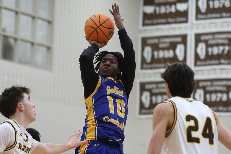 Joliet Central’s James Lee takes a shot against Joliet Catholic on Tuesday, Jan 20, 2026 in Joliet.