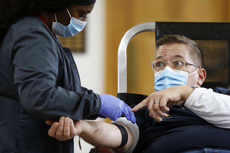 Edward Varga, of Richmond, has blood drawn by phlebotomist Katrina White during a Versiti blood drive hosted by the Knights of Columbus and Girl Scouts on Saturday, Nov. 20, 2021 at St. Joseph's Catholic Church in Richmond. A shortage in the blood supply has again resurged and blood drives are hopeful for donors.