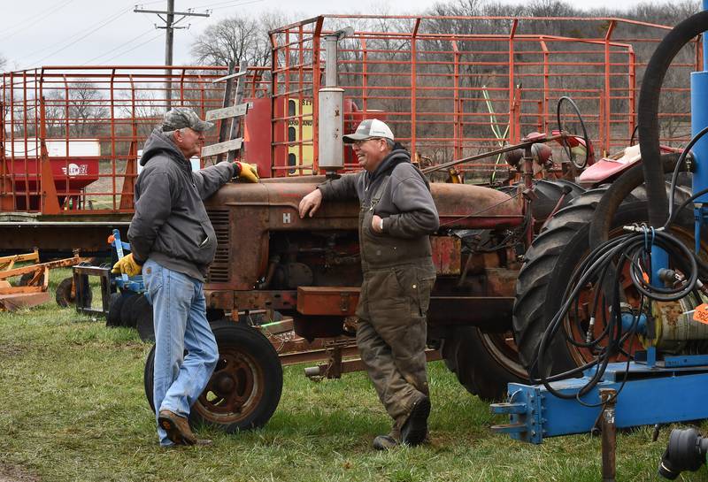 Jim Hart of Ashton and Barry Bernard of Leland chat at the Spring Hazelhurst Consignment Sale held Saturday, April 4, 2026. The annual auction draws farmers from across the region who are looking to buy or sell farm equipment before the planting season begins.