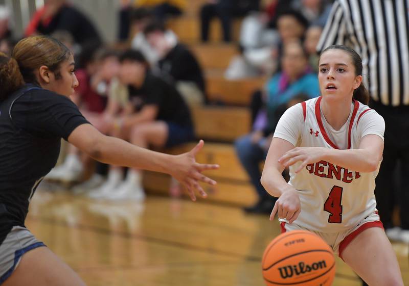 Benet’s Ava Mersinger (4) passes the ball past Oswego East’s Jaliyah Shepard during the Class 4A Benet Regional final on February 19, 2026 at Benet Academy in Lisle.