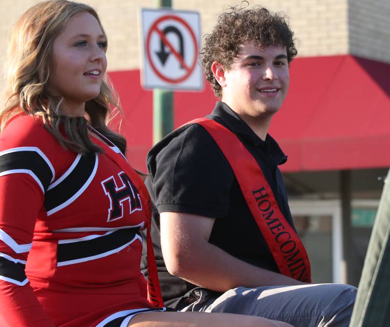 Hall queen and king candidates Geno Baracani and Hannah Vanaman ride in the Hall High School Homecoming parade on Thursday, Sept. 28, 2023 in Spring Valley.