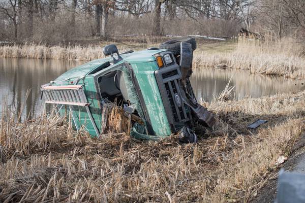 Car crashes through guardrail and into marsh near Woodstock 