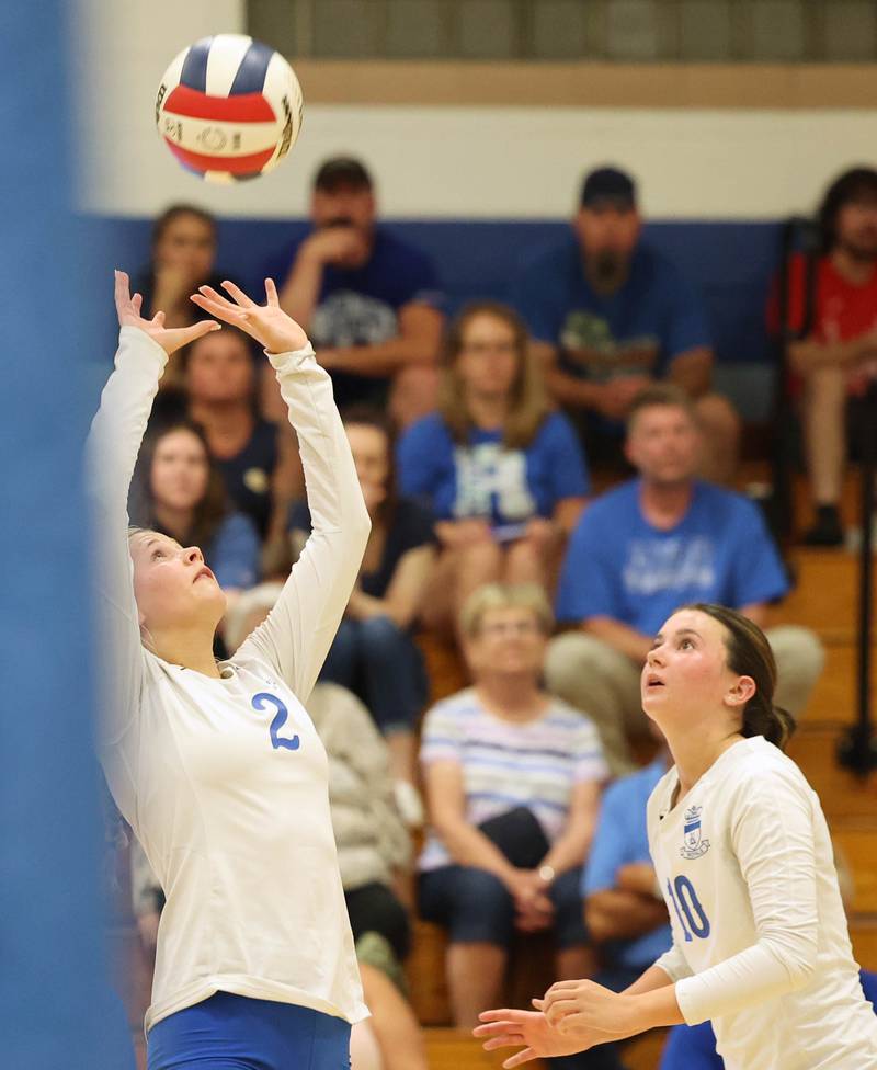 Hinckley-Big Rock’s Anna Herrmann sets the ball for Madeline Hogan during their match against Aurora Christian Tuesday night at the school in Hinckley.