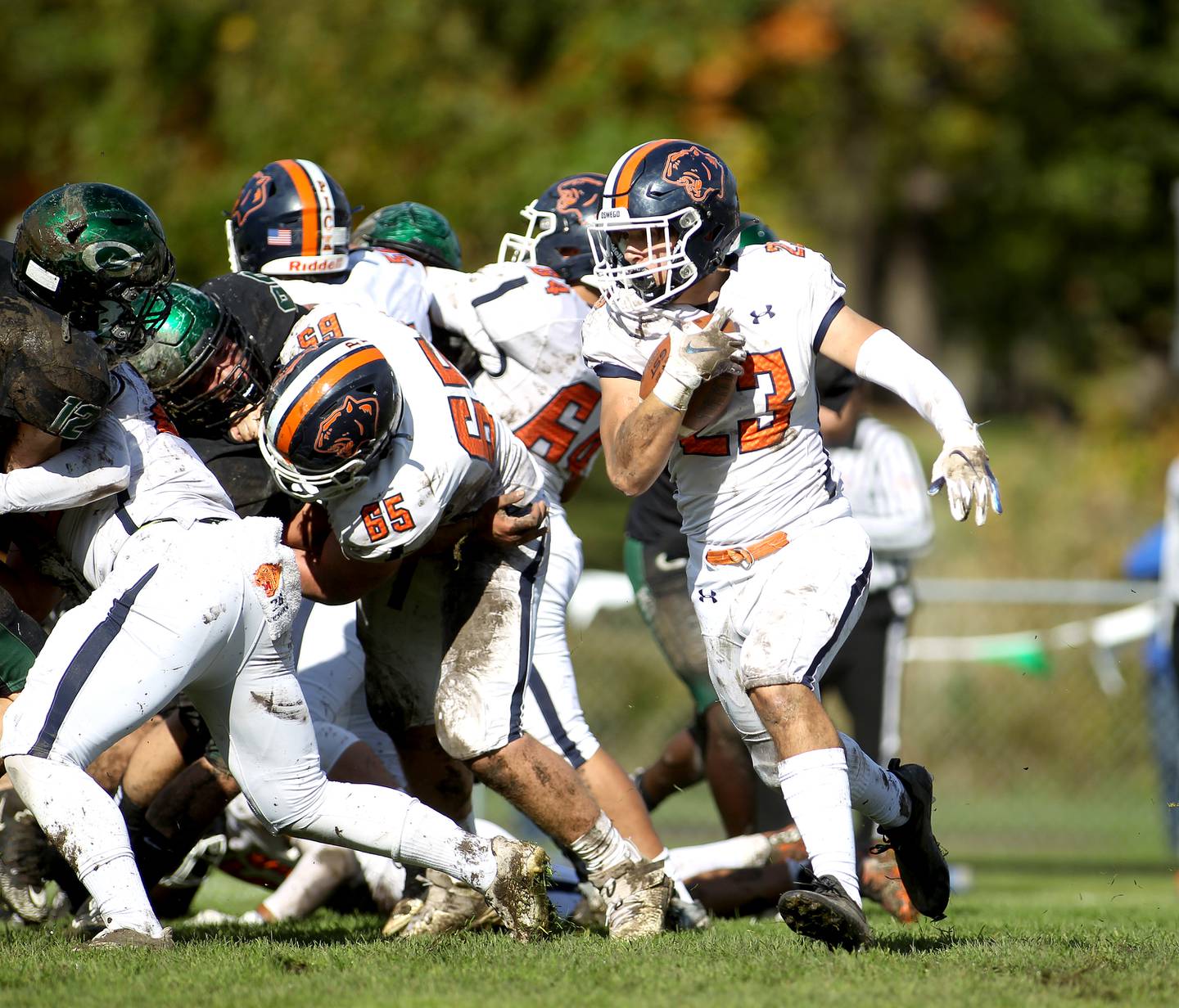 Oswego's Braedon Hellinger carries the ball during a Class 8A playoffs first-round game at Glenbard West in Glen Ellyn on Saturday, Oct. 30, 2021.