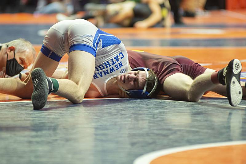 Newman's Carter Rude loses to Wood River's Jason Shaw in 126lbs during the 1A fifth place match at the IHSA state wrestling meet on Saturday, Feb. 19, 2022.