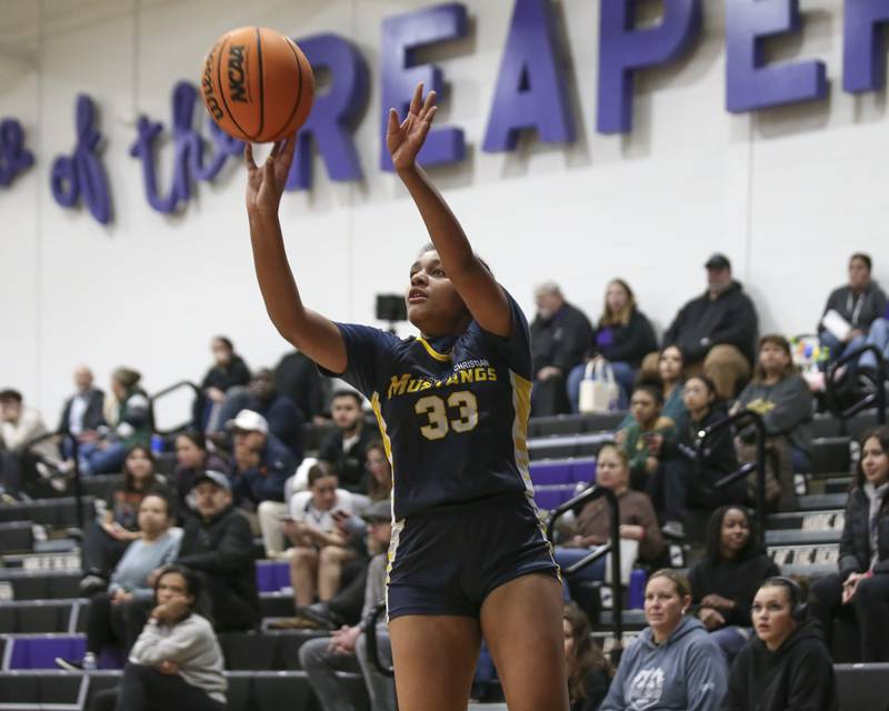 Yorkville Christian's Kiana Ogulei (33) shoots a three during their basketball game between Yorkville Christian at Plano Wednesday, Jan 07, 2026 in Plano.