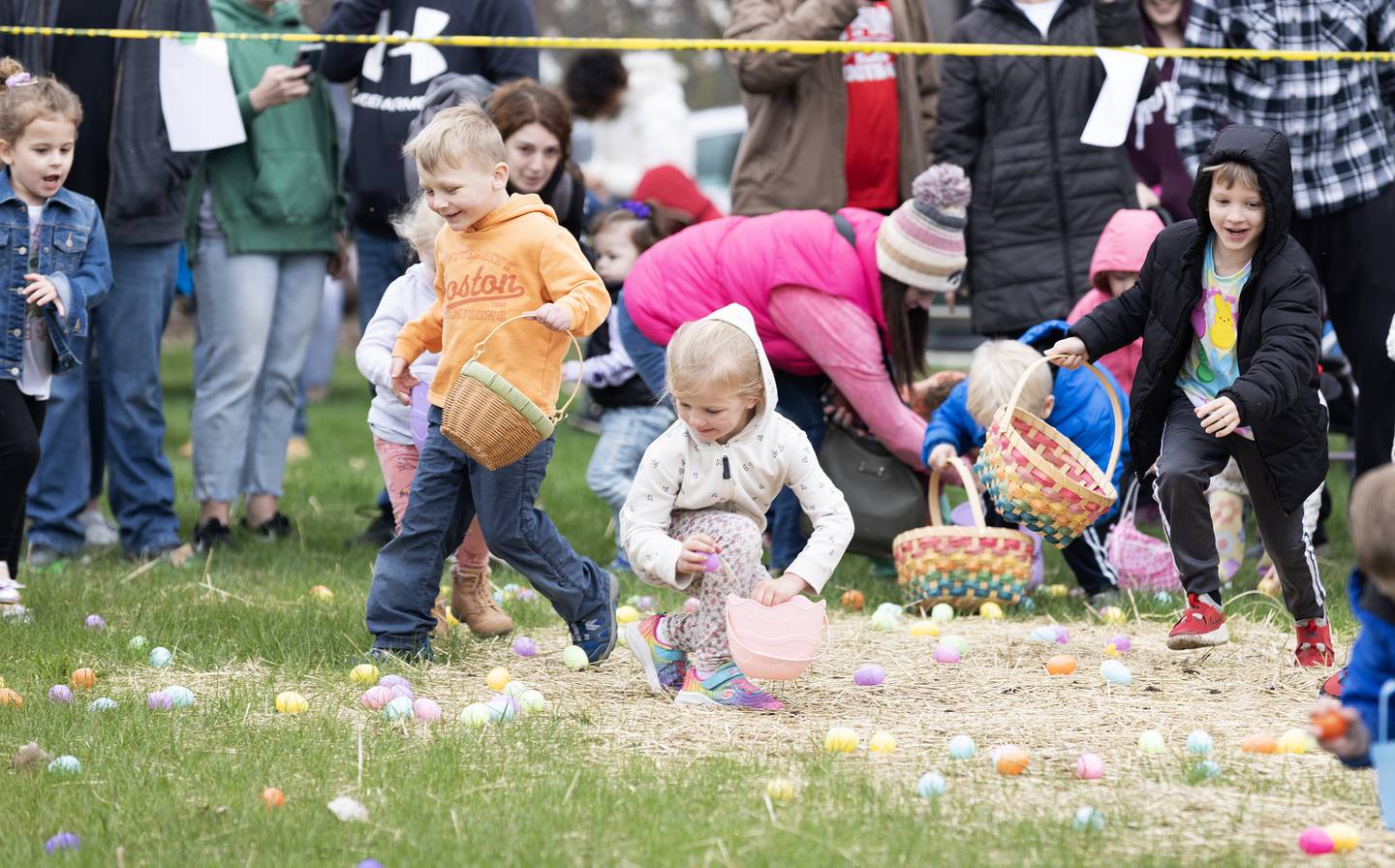 Children scramble at the egg hunt during the Hurray for Spring event Saturday, March 30, 2024, in Ottawa's Jordan block.