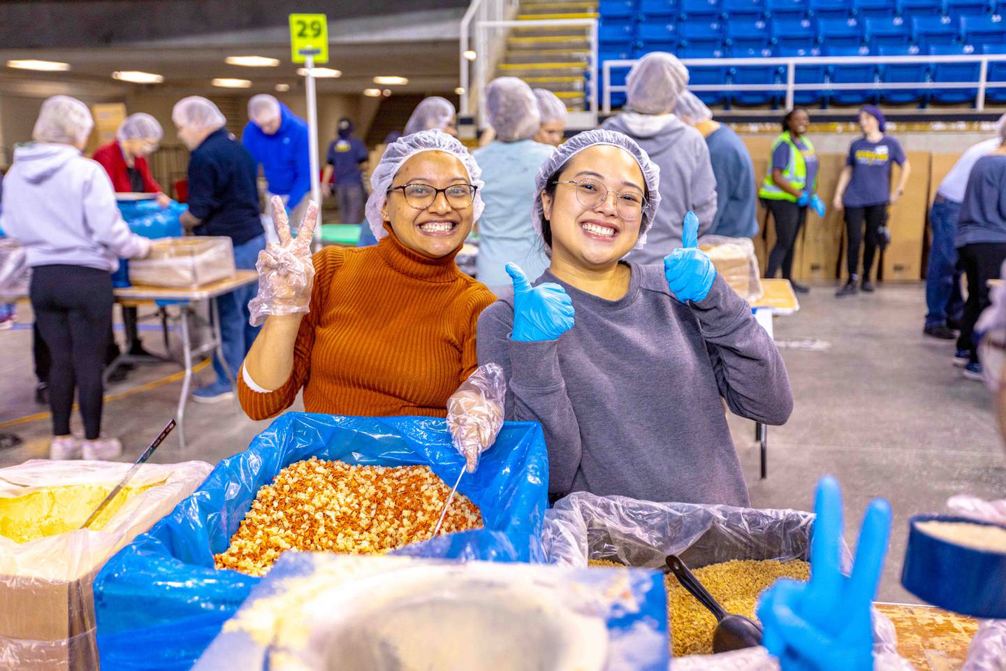 Families with children ages 5 and up can work together as a team to pack MannaPack® meals at Feed My Starving Children in Aurora.