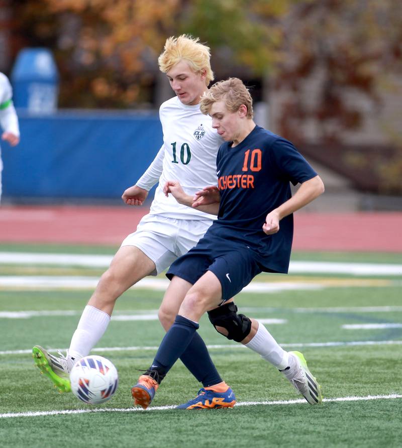 Crystal Lake South’s Nolan Getzinger (left) and Rochester’s Brenden McArdle (right) go after the ball during the Class 2A state semifinal match at Hoffman Estates High School on Friday, Nov. 3, 2023.