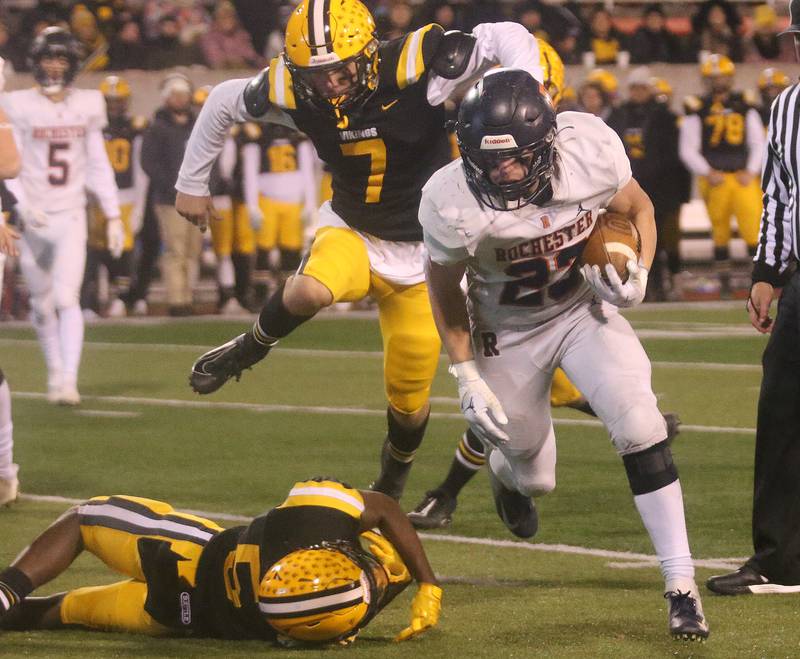 Rochester's Nolan Mrozowski runs around St. Laurence's Jaylen Hayes and being chased down by teammate Timmy Allison during the Class 4A State football championship on Friday, Nov, 24, 2023 at Hancock Stadium in Normal.