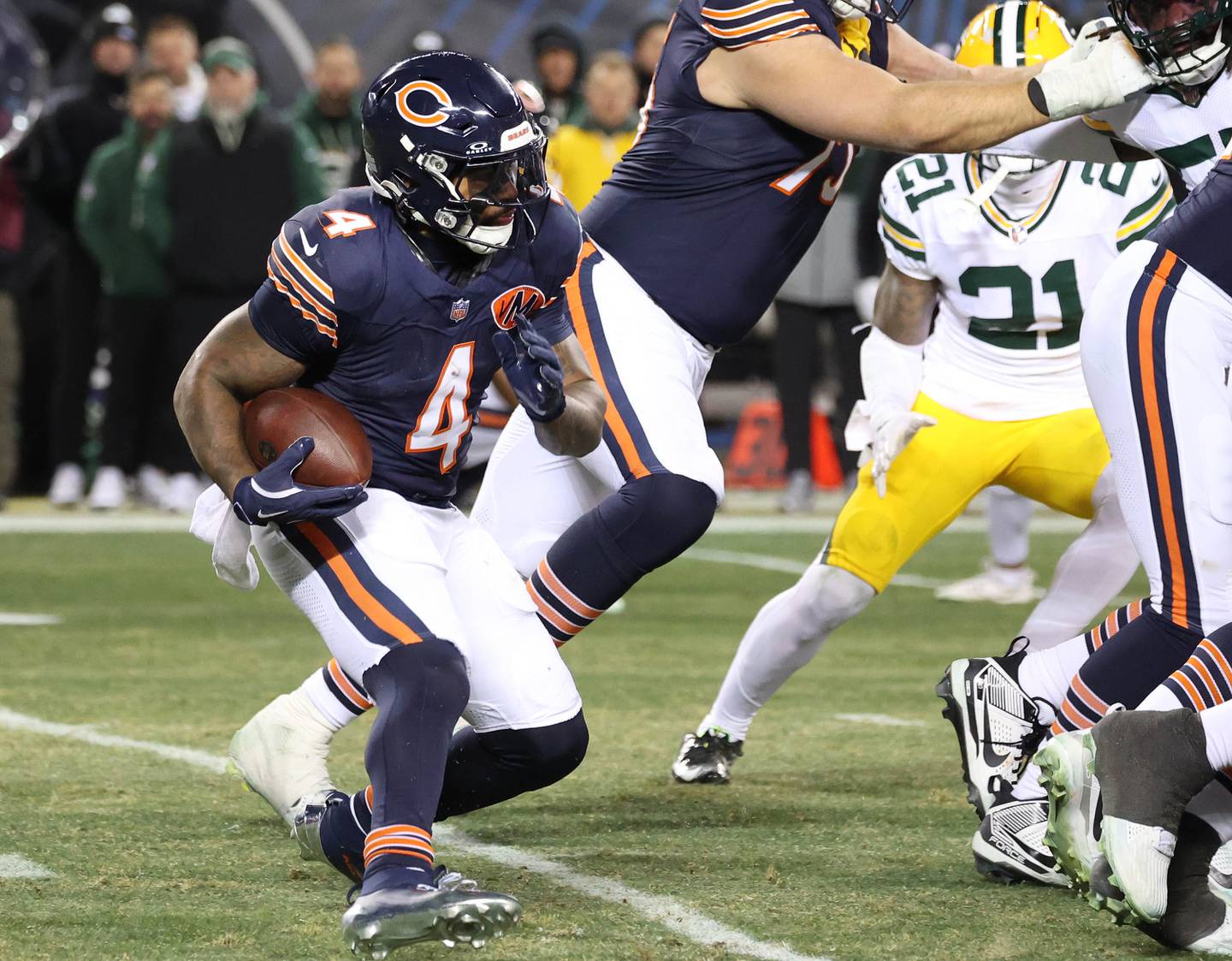 Chicago Bears running back D'Andre Swift looks for an opening in the Green Bay Packer defensive line Saturday, December 20, 2025, during their game at Soldier Field in Chicago.