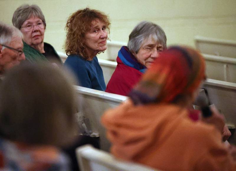 People listen to speakers sharing their feelings Monday, Feb. 2, 2026, during the Vigil for Peace at the First Congregational United Church Of Christ in DeKalb. The vigil is being held in remembrance of those lost in recent ICE related shootings and to show solidarity with the people of Minnesota.