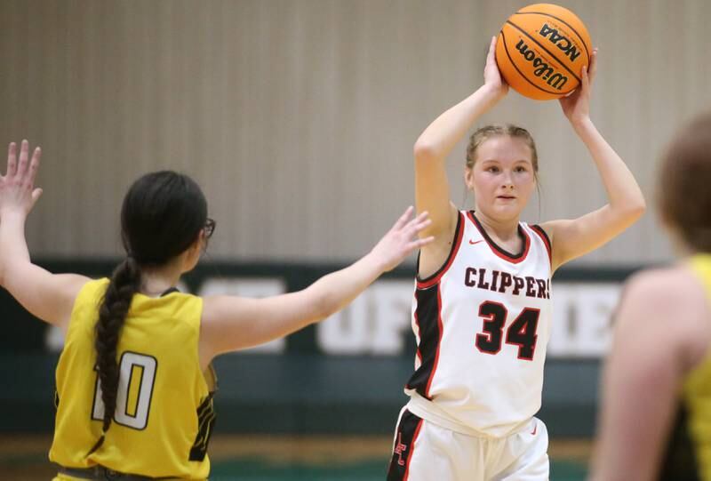 Amboy/Ohio's Bella Yanos looks to pass the ball around Putnam County's Addy Leatherman during the Class 1A Regional semifinal game on Tuesday, Feb. 18, 2025 at St. Bede Academy.