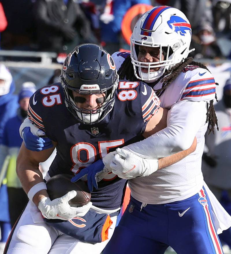 Chicago Bears tight end Cole Kmet tries to break the tackle of Buffalo Bills linebacker Tremaine Edmunds during their game Sunday, Dec. 24, 2022, at Soldier Field in Chicago.