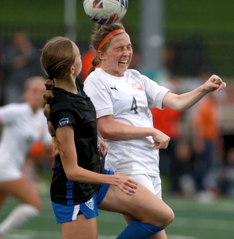 Wheaton Warrenville South's Ashley Alman heads the ball away from St. Charles North's Kaitlyn Nudera during the Class 3A Glenbard West Sectional final on Friday, May 30, 2025 in Glen Ellyn.