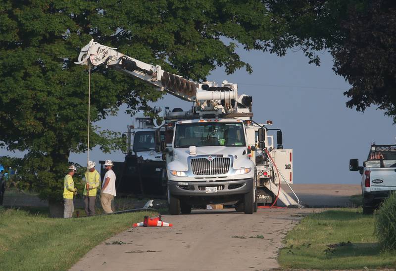 Ameren crews replace a power pole on South Street on Monday, June 17, 2024 in Dover. Streamline winds knocked out power to the town.  Down limbs, power lines closed roads in the town.