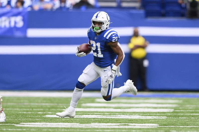 Indianapolis Colts running back Nyheim Hines (21) runs to the outside during an NFL football game in Indianapolis. (AP Photo/Zach Bolinger)
