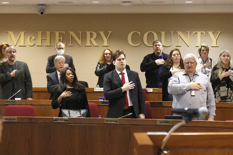 Members of the McHenry County Board   say the Pledge of Allegiance during a Committee of the Whole meeting Thursday, Dec. 15, 2022, in the McHenry County Administration Building in Woodstock.