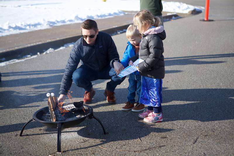 Roasting marshmallows at Frozen Fest at Maryknoll Park on Saturday, Jan. 11, 2025 in Glen Ellyn.