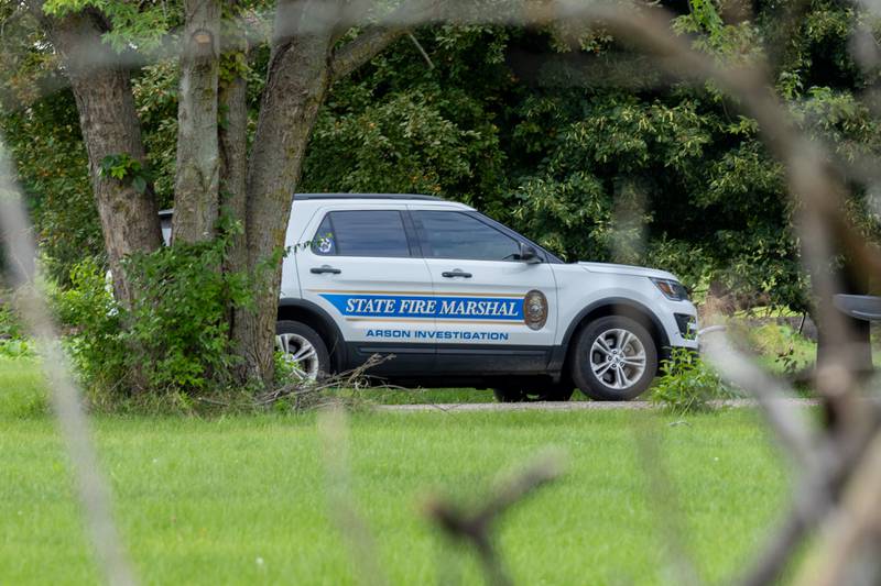 State fire Marshall vehicle is parked at crime scene of double homicide on Thursday, July 17, 2025 on 42nd Road in Sheridan.