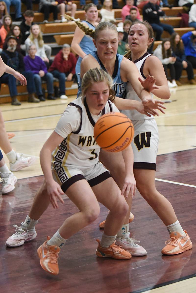 Watseka/Milford's Rennah Barrett, left, and Christa Holohan, right, and Cissna Park's Josie Neukomm battle for a rebound during a game at Watseka Monday, Feb. 9, 2026.