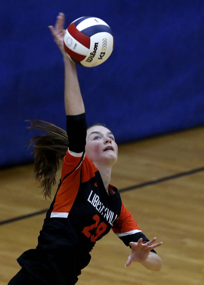 Libertyville's Claire Evans serves the ball during an IHSA Class 4A McHenry Sectional volleyball match against Hampshire on Tuesday, Nov. 5, 2024, at McHenry High School Freshman Campus.