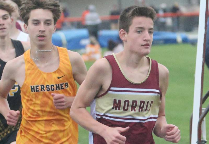 Herscher's Jackon Kruse runs with Morris's Everett Swanson in the 3200 meter run during the Class 2A Sectional meet on Wednesday, May 21, 2025 at Pontiac High School.