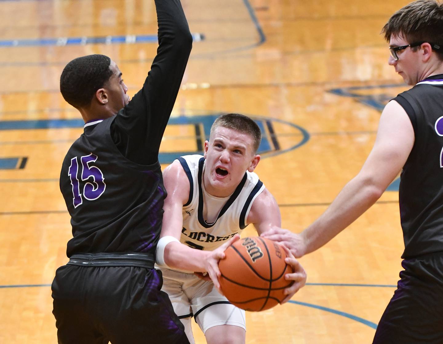 Fieldcrest's Ed Lorton draws a foul as he maneuvers to the basket under pressure from two Manteno defenders during last season's Class 2A Clifton Central Sectional semifinal game.