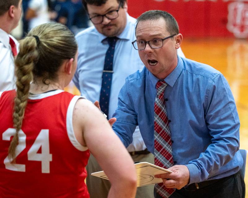 Ottawa's Head Coach Brent Moore talks to team during timeout of Regional Championship game on Thursday, Feb. 19, 2026 in Sellett Gymnasium at L-P High School.